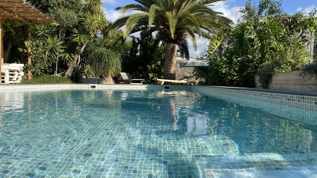 Blue swimming pool waterline and tiles, Swimming pool leak detection in Cornwall