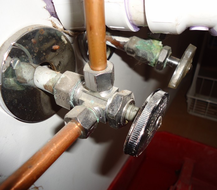 Close-up of a leaking pipe valve pinpointed during acoustic leak detection in Cornwall