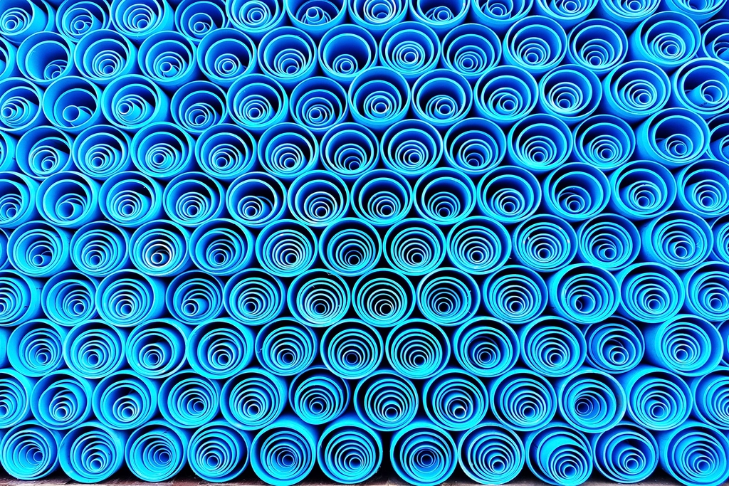 Blue MDPE water supply pipe close-up, the kind we trace and test during underground water leak detection in Cornwall